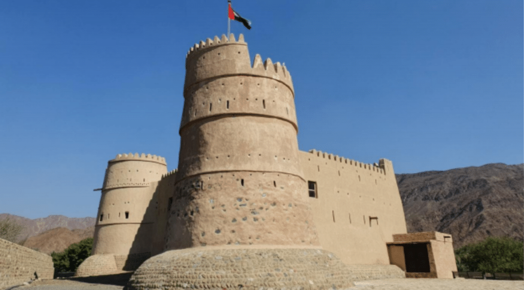 Best places to visit in Fujairah featuring the coastline, Hajar Mountains and historic fort